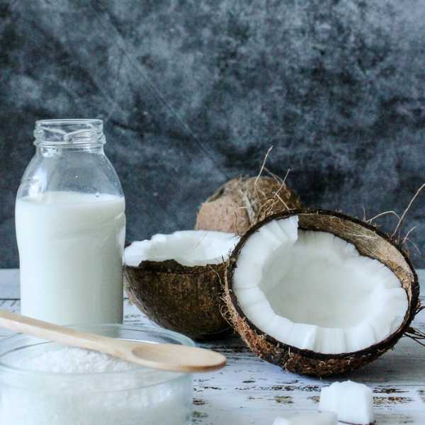 Coconut milk and coconut on the table