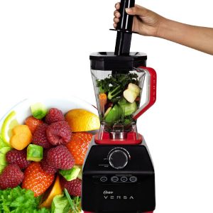 An Oster Versa 1400 being used to blend fruits and vegetables