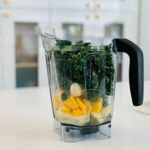 blender with green vegggies and fruits